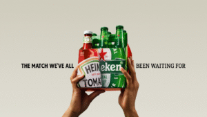 Hands holding the 5+1 Heinz and Heineken collaboration pack, illustrating the behavioural science behind successful FMCG brand partnerships.