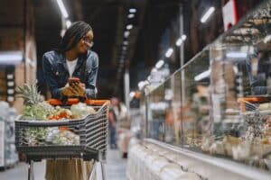 A busy retail environment illustrating the challenge of capturing consumer attention and the need for shopper observation.